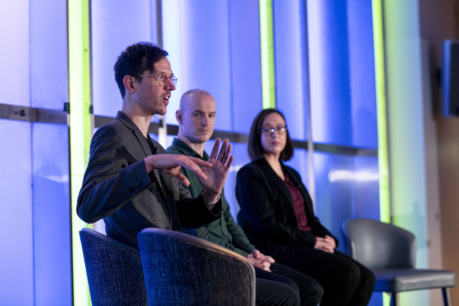 Ed Parker from LSHTM answers a question during the panel session. Will
Hulme and Andrea Schaffer are on stage with him