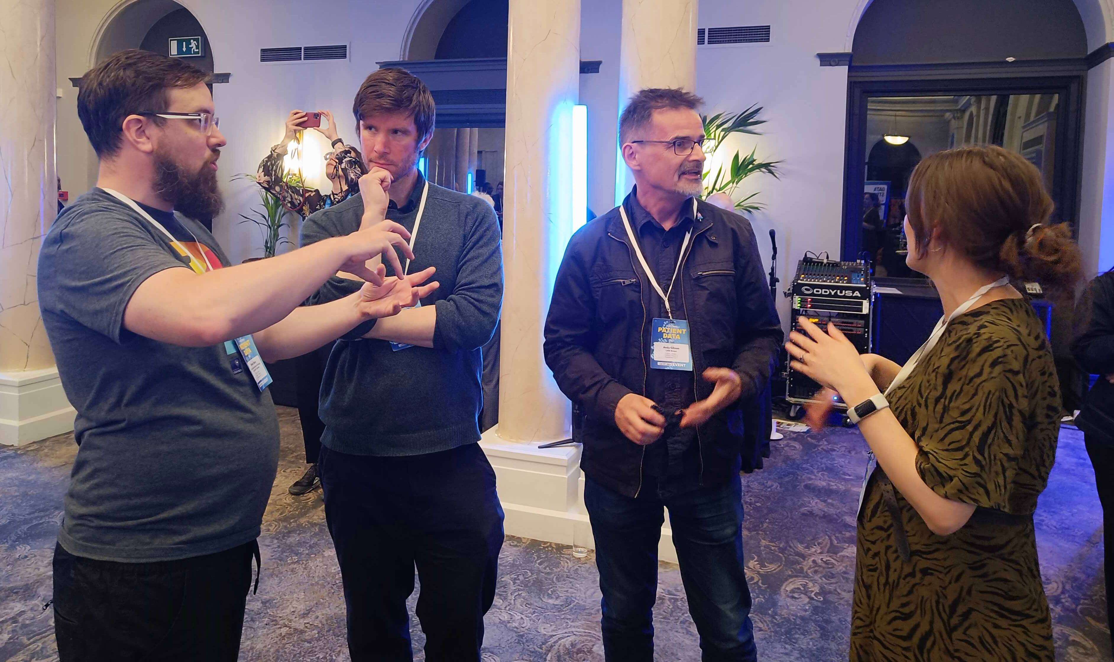 Simon Davy and Frederica Longfoot chatting with John Kellas and Andy Gibson, respectively.