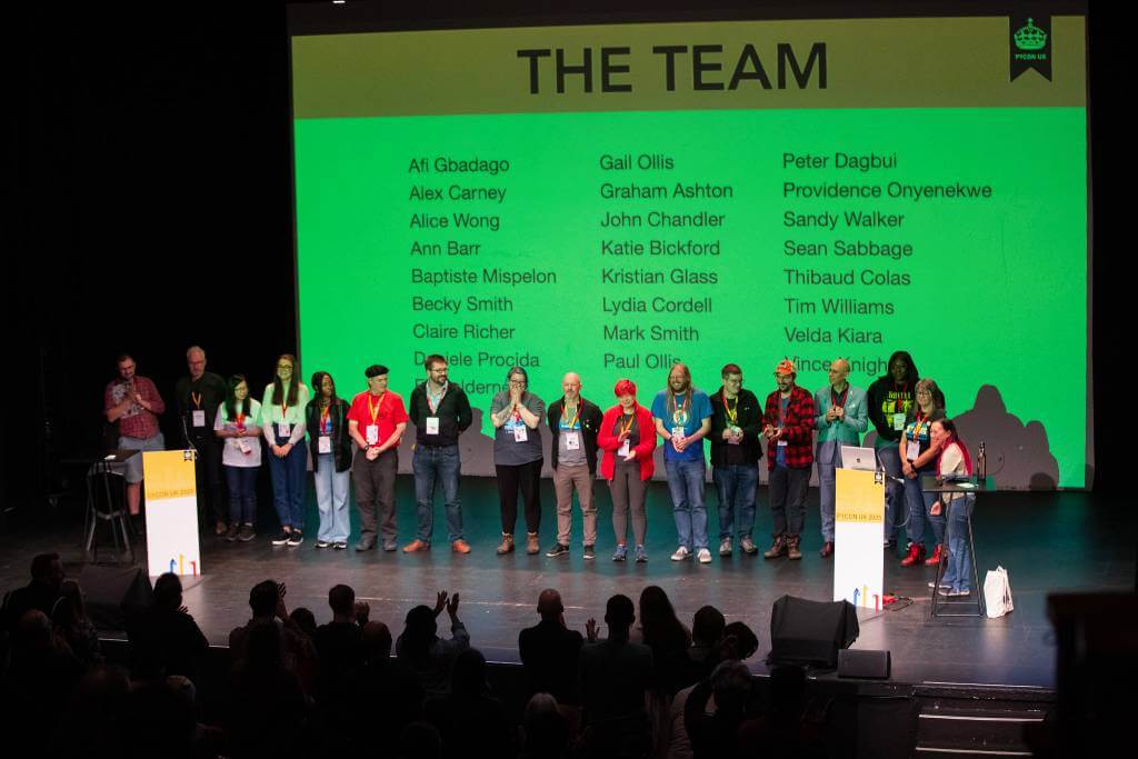 Some of the organisers on stage during the closing talks of the conference, including all 5 Bennett staff on the organising team.
